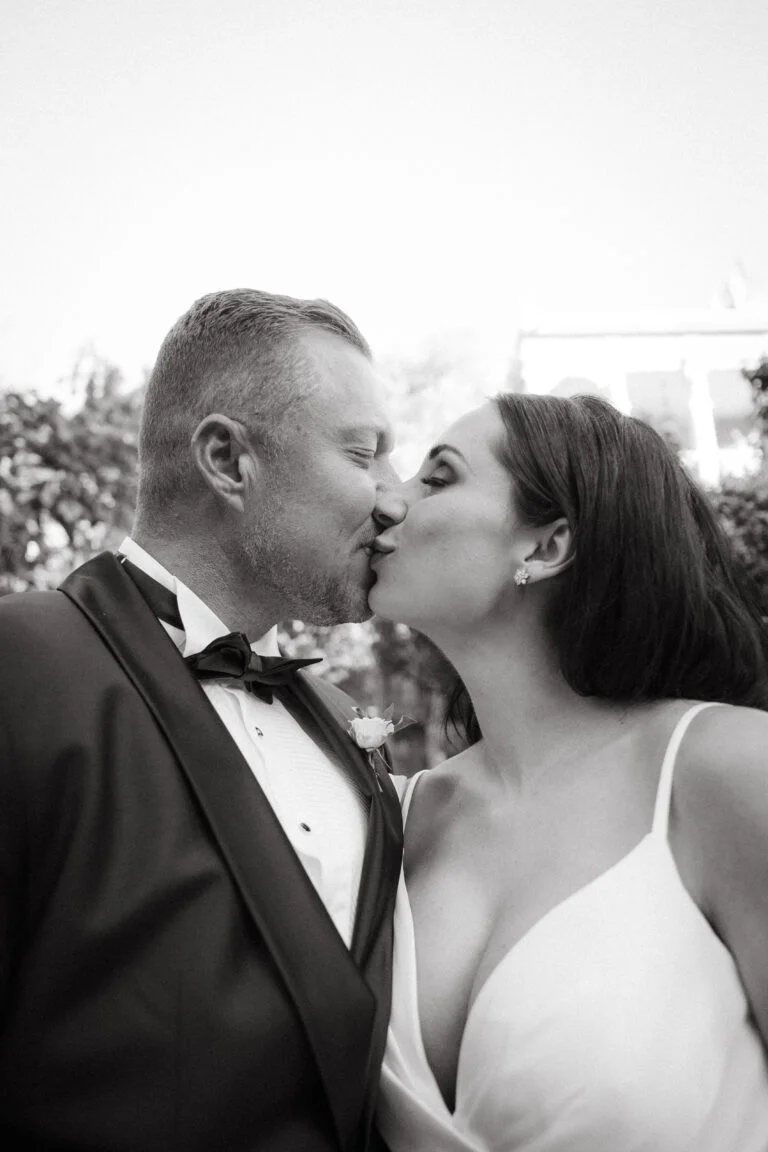 Portrait of Bride and Groom kissing at Shepstone Gardens