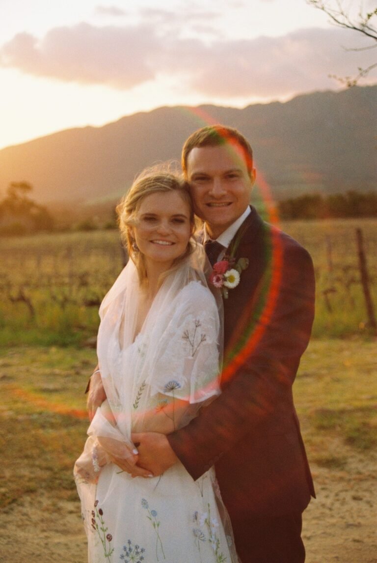 Wedding couple on 35mm with a lens flare