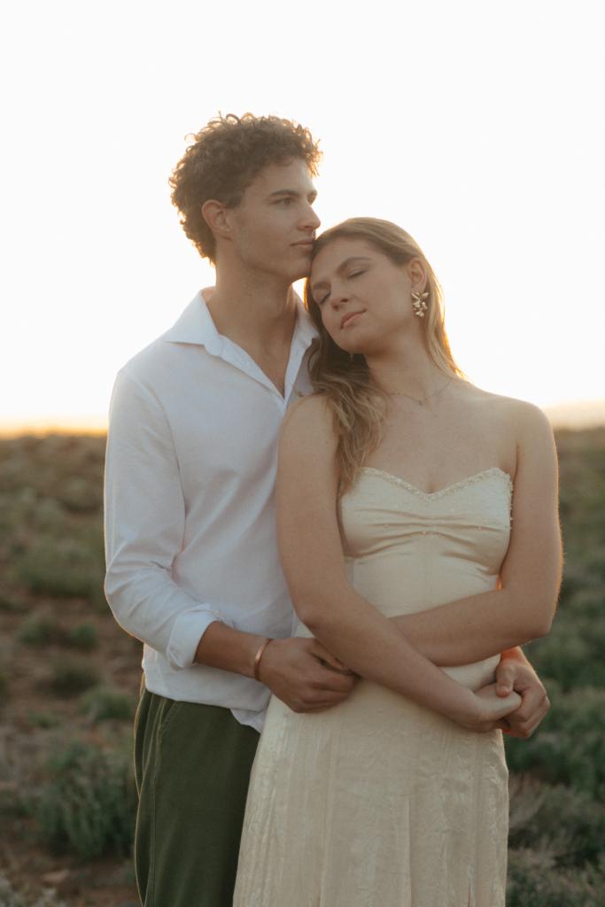 Wedding couple standing intimately in the Tankwa Karoo