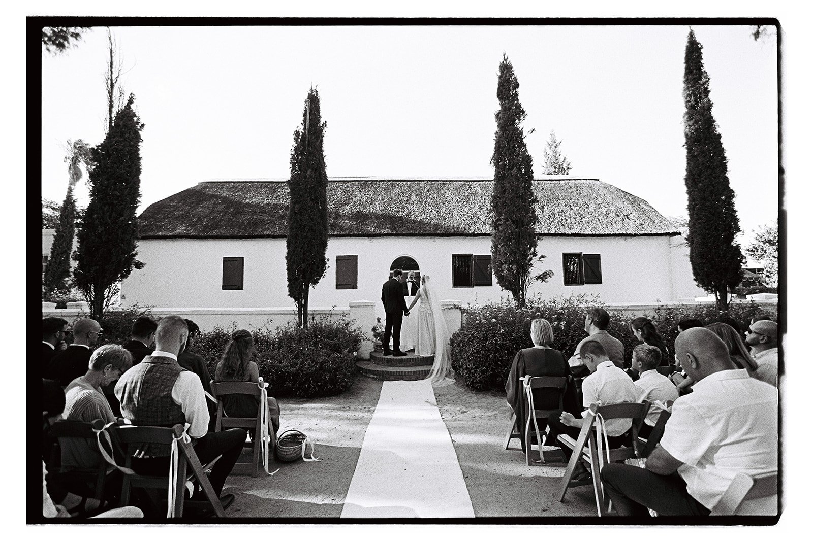 Black and white film image of a wedding ceremony