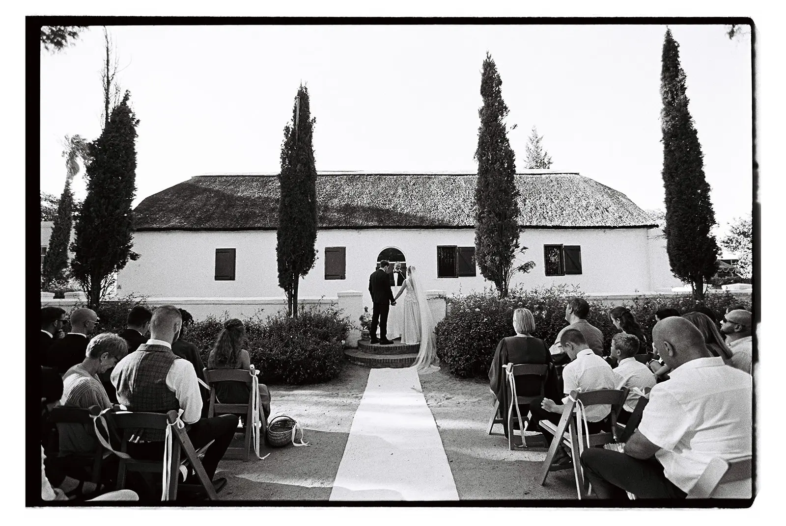 Black and white film image of a wedding ceremony