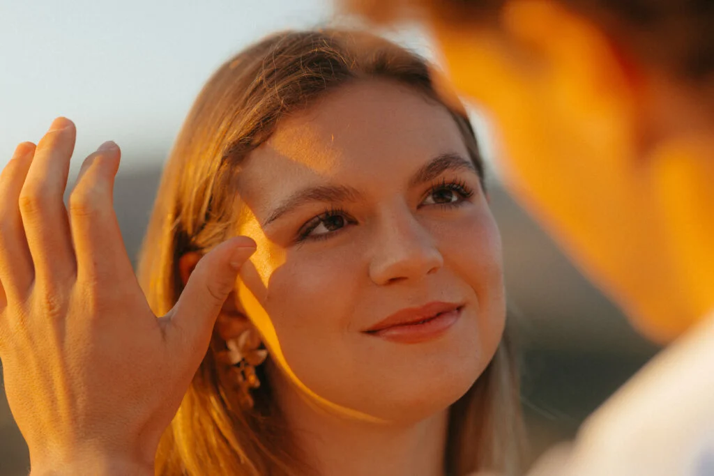 Bride has her tear wiped away by her groom