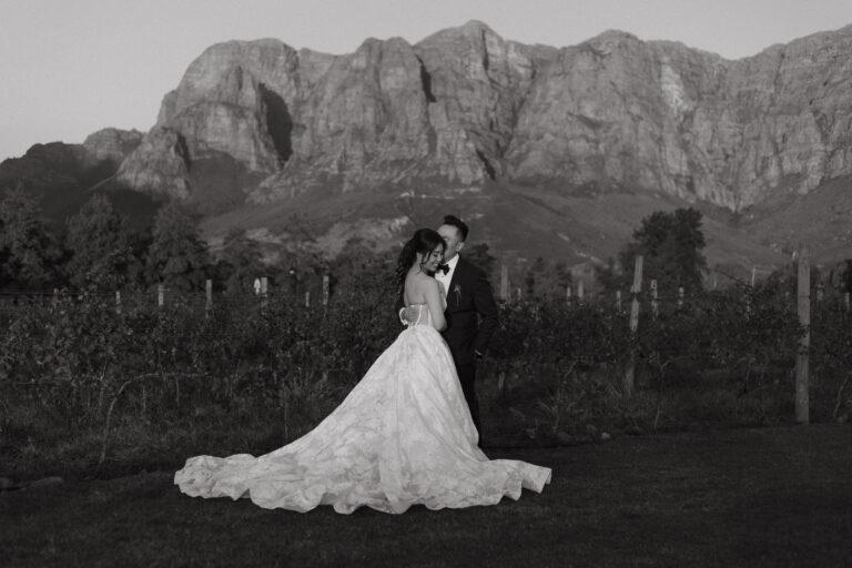 Wedding couple in front of franshoek mountains