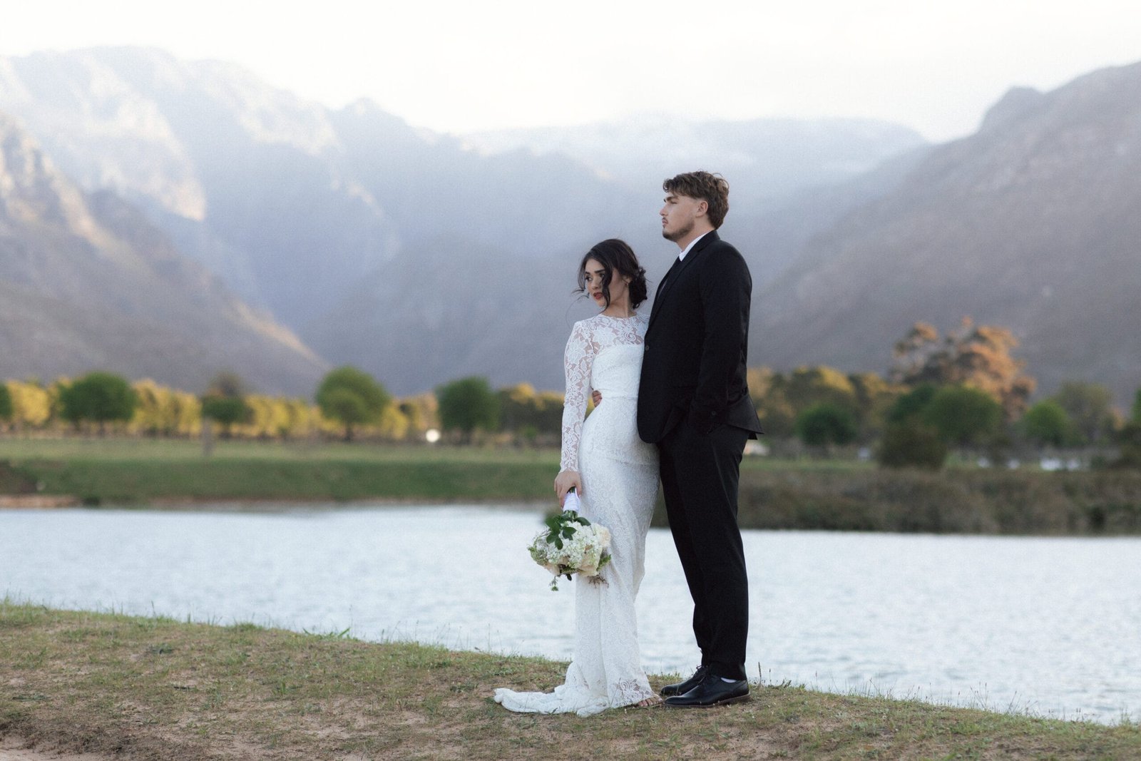 Wedding couple, framed by the mountains at La Roche Estate