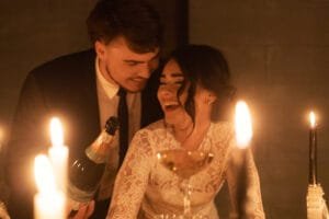 Wedding couple laughing during a champagne tower