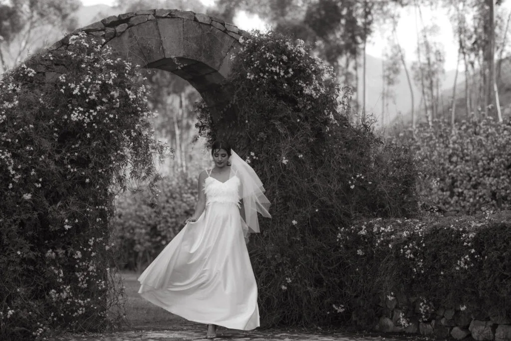 Bride standing at a stone entranceway