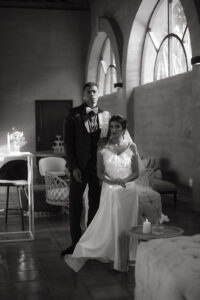 Wedding photography of a wedding couple sitting at La Roche