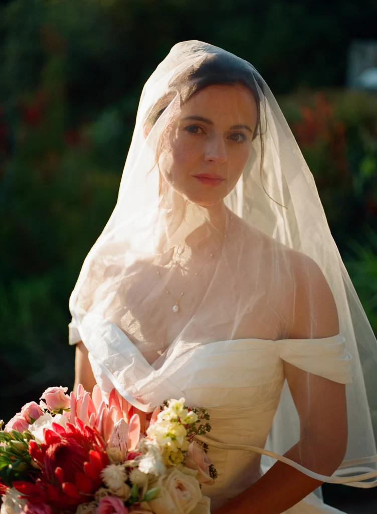 Soft-editorial wedding image of a bride on film