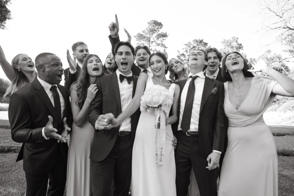 Candid photo of a wedding party cheering by Cape Town wedding photographer Curator Photography
