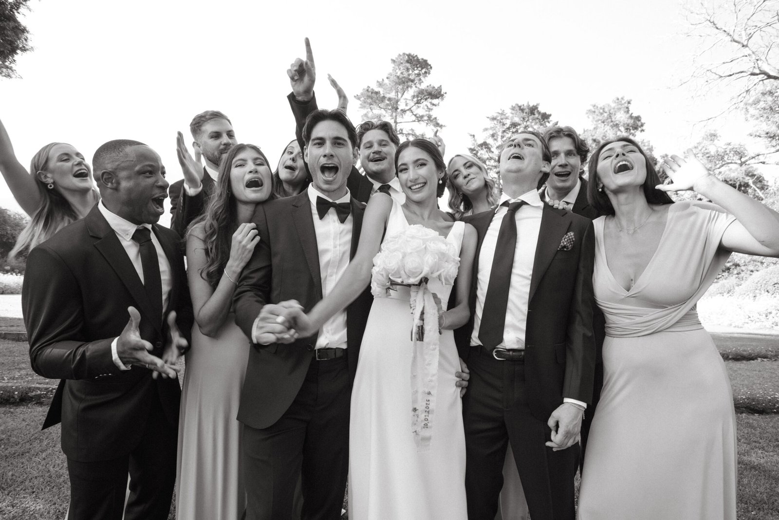 Candid photo of a wedding party cheering by Cape Town wedding photographer Curator Photography