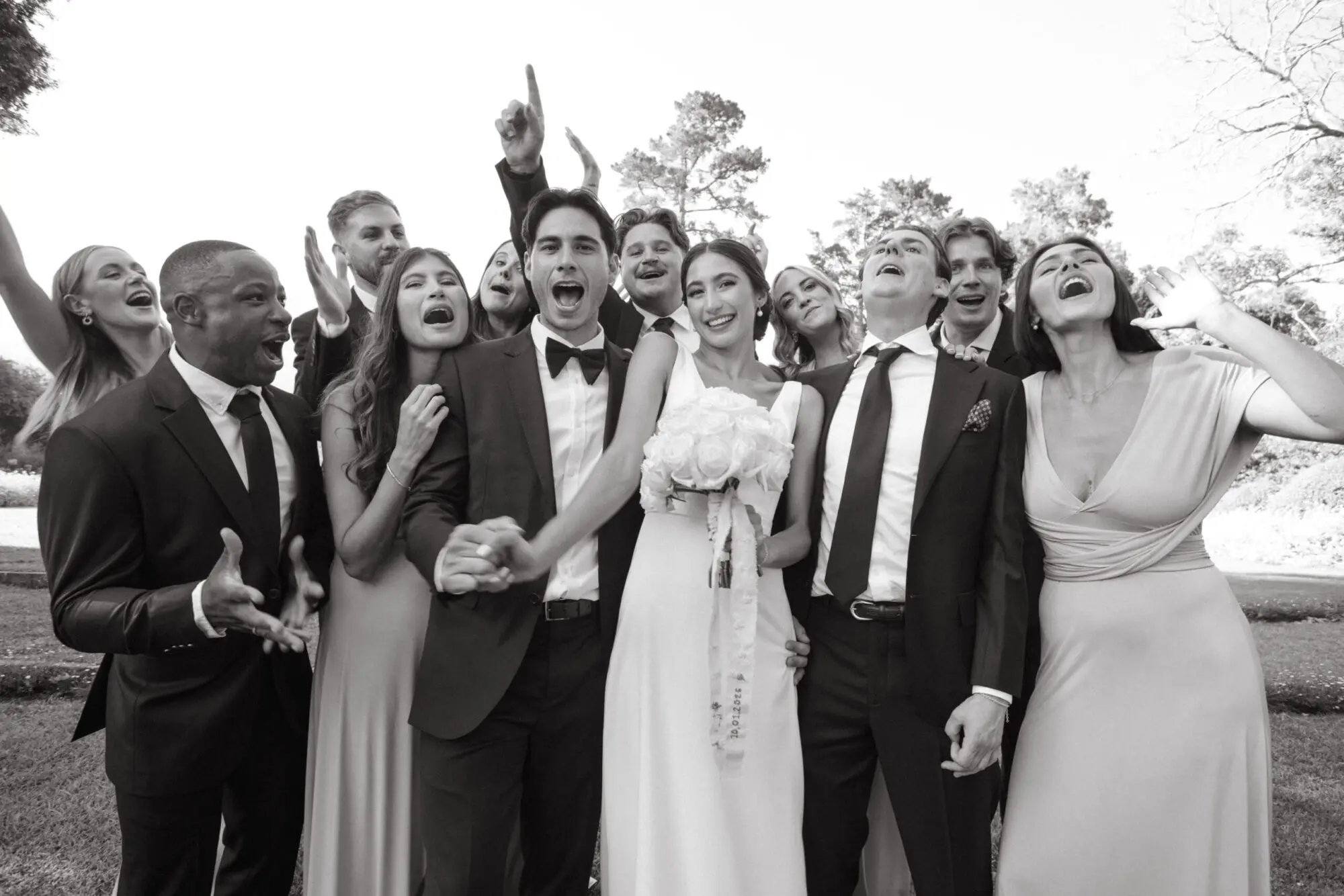 Candid photo of a wedding party cheering by Cape Town wedding photographer Curator Photography