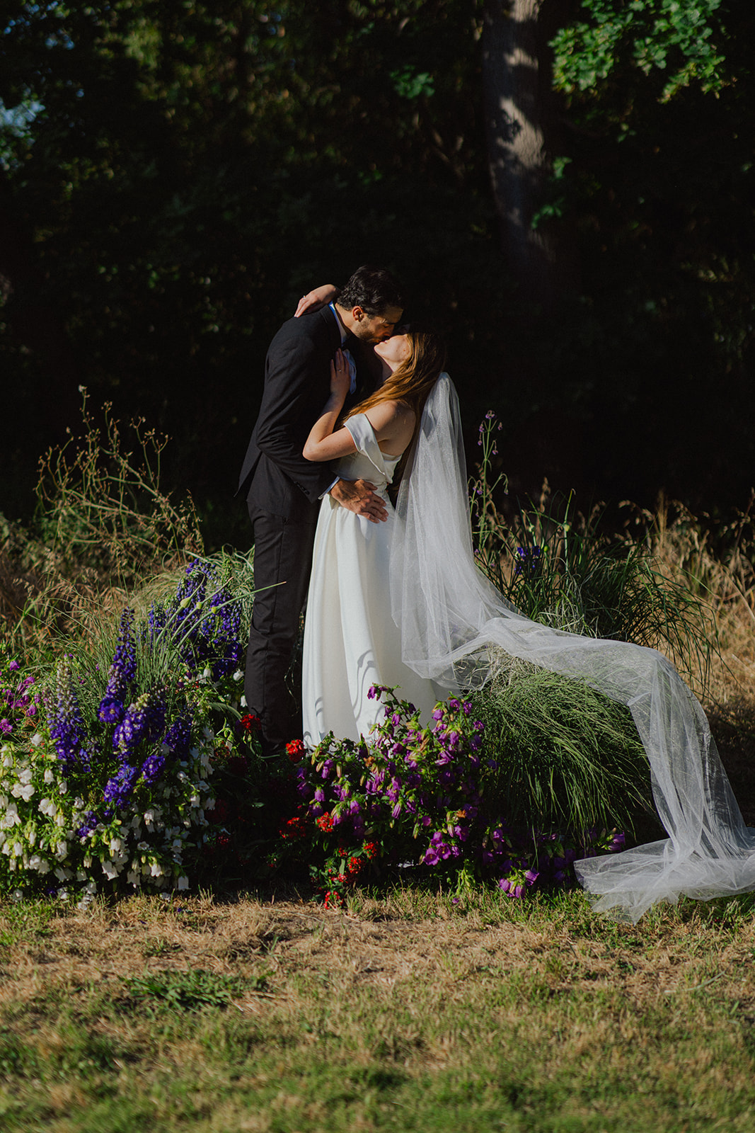 Wedding couple kissing at their wedding at La Plasir