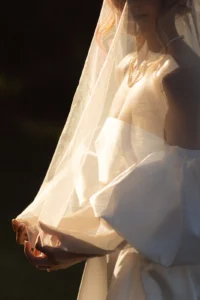 Sunlit detail shot of a bride