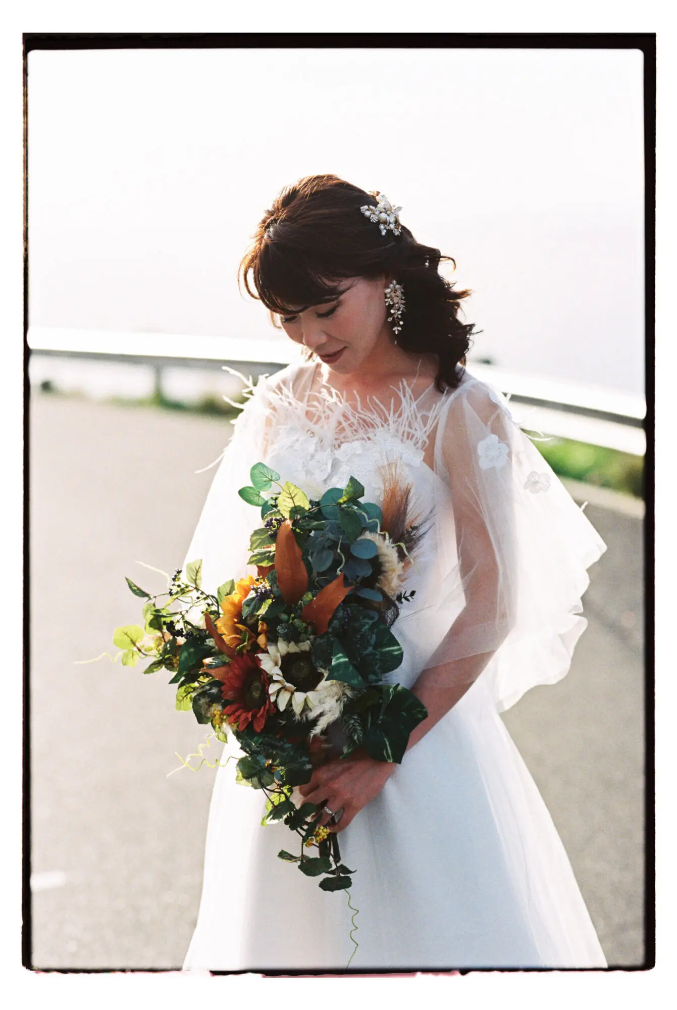 Bride with flowers on film by Cape Town wedding photographer Curator Photography