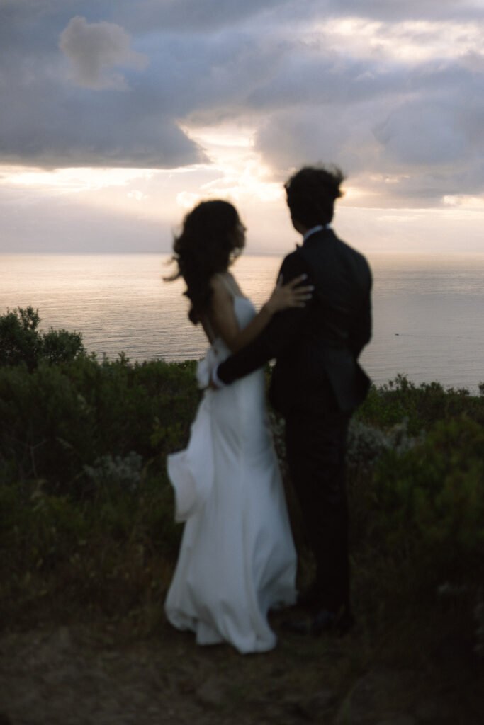 Couple photographed on signal hill during their old money wedding